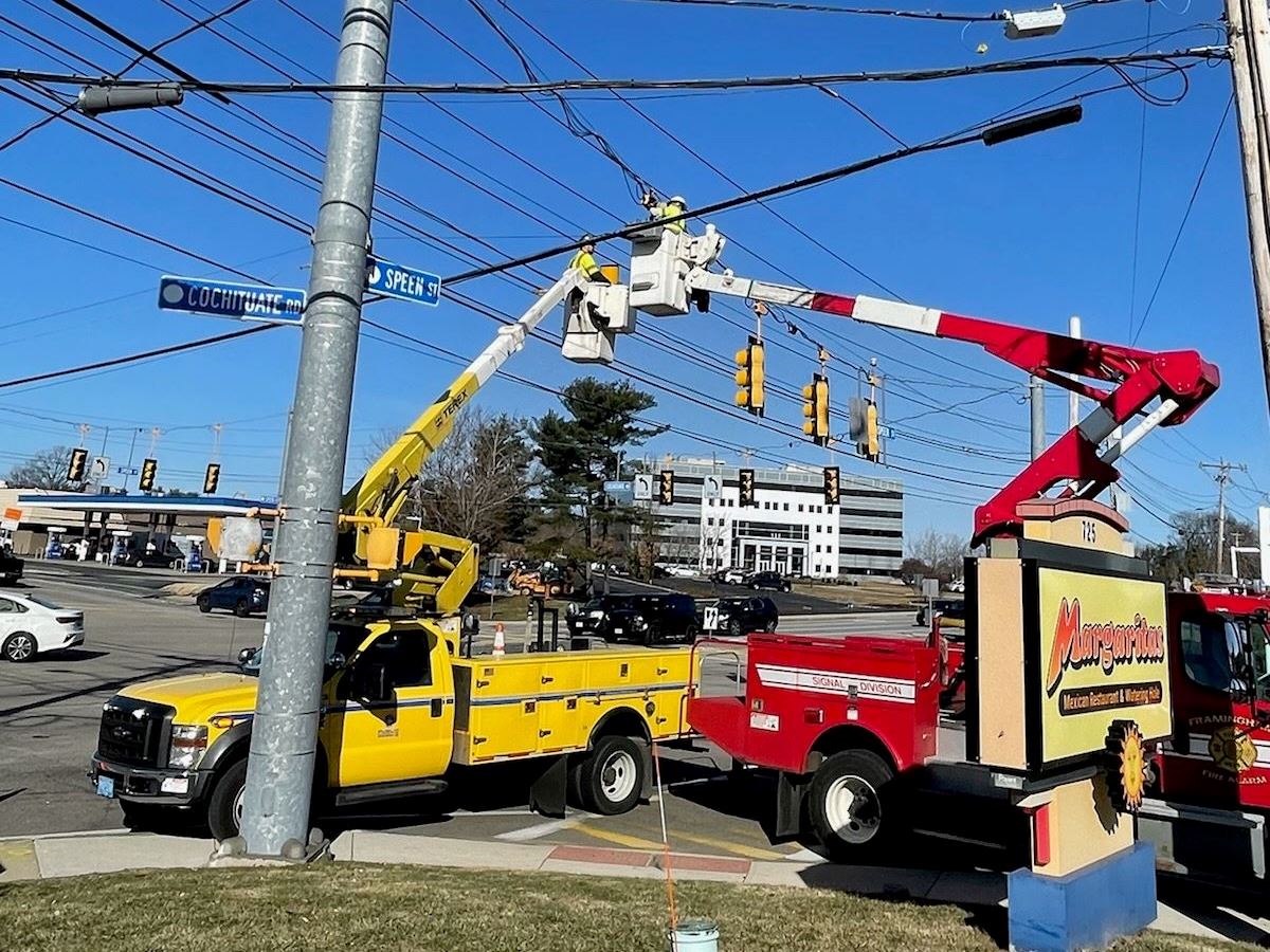 The Lighting and Signals Division crew working diligently on the street, repairing lights and traffi